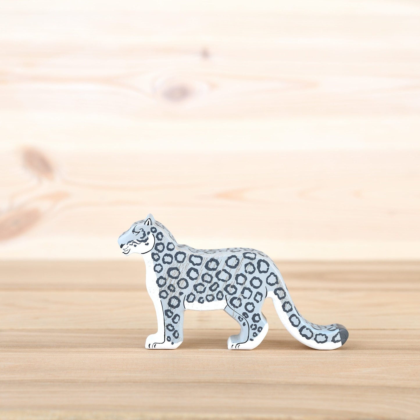 Wooden snow leopard figurine ounce