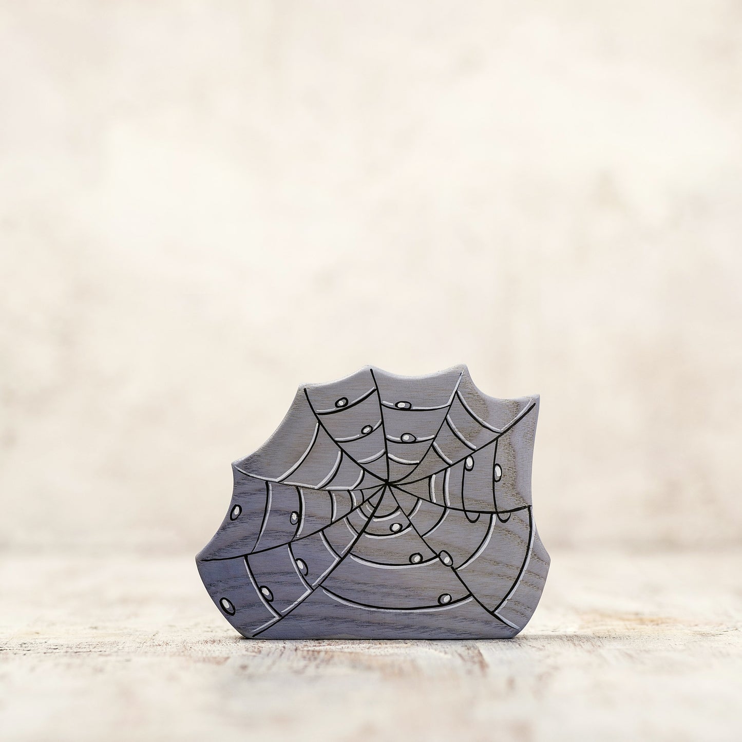 Wooden Dewdrop covered spider web toy