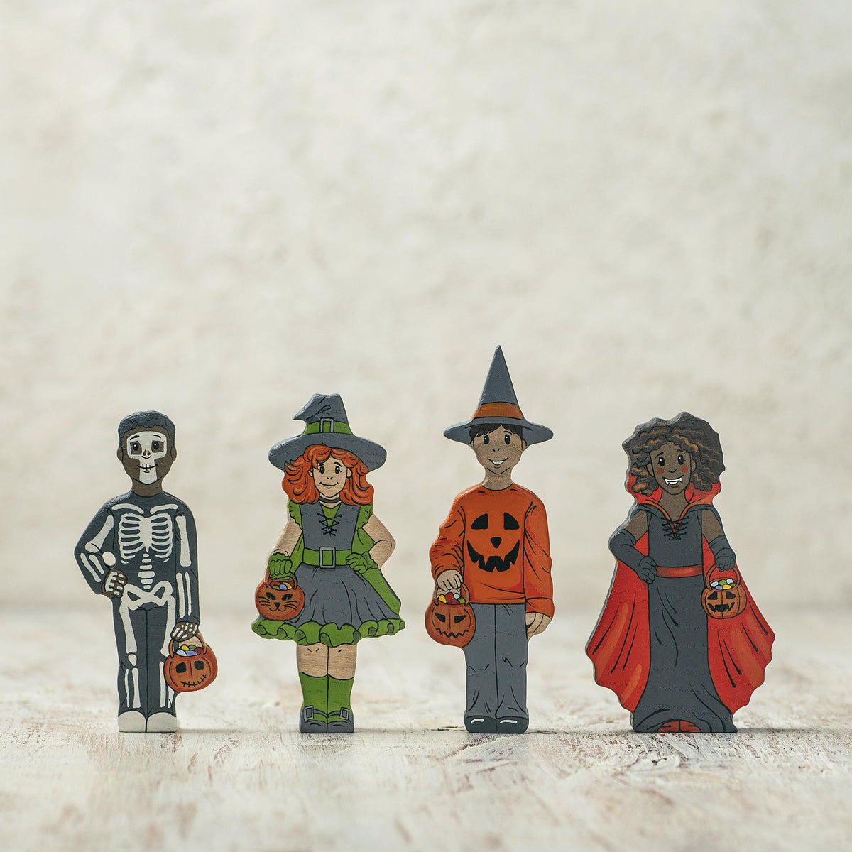 Wooden trick-or-treating skeleton toy