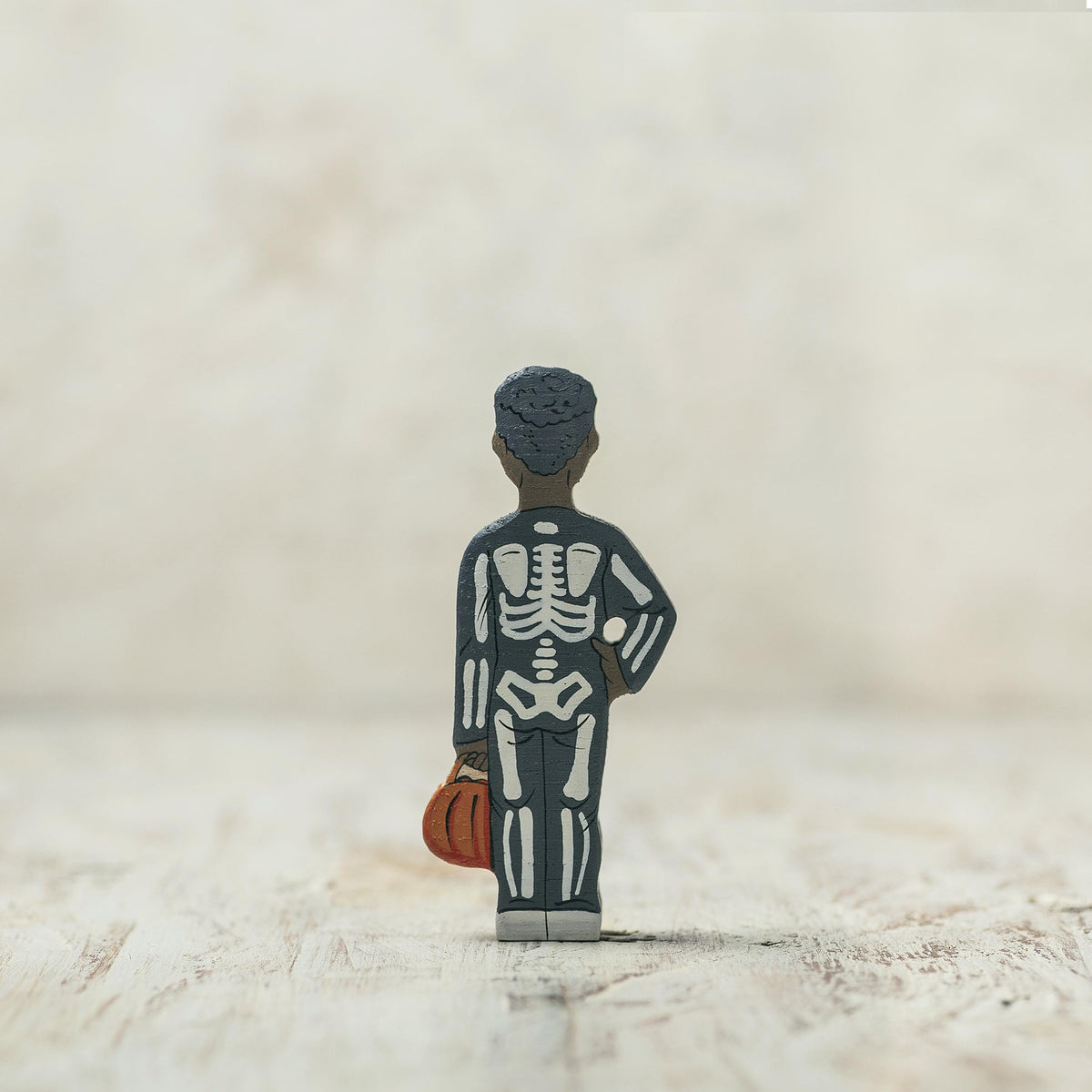 Hand-painted wooden Halloween skeleton figurine