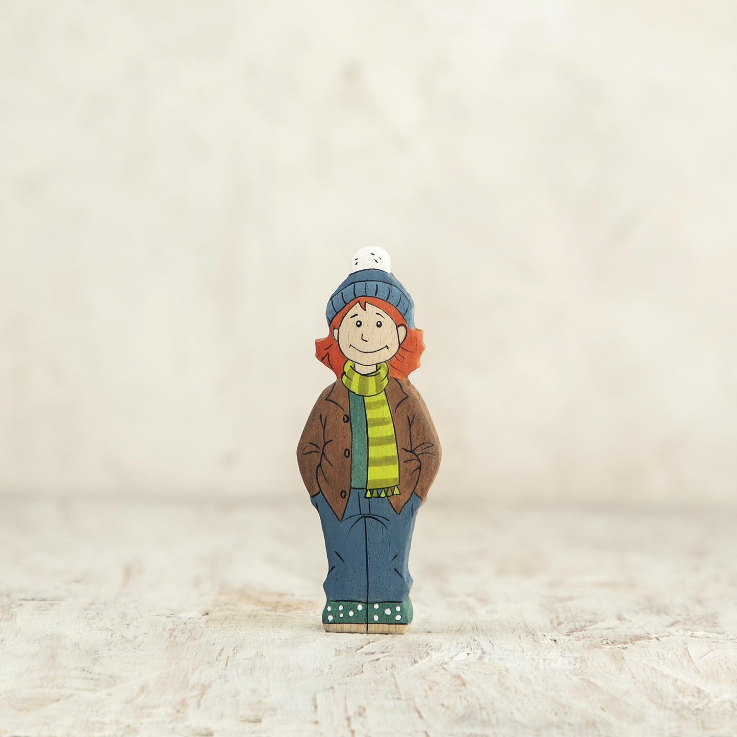 Wooden Girl Figurine in Brown Coat