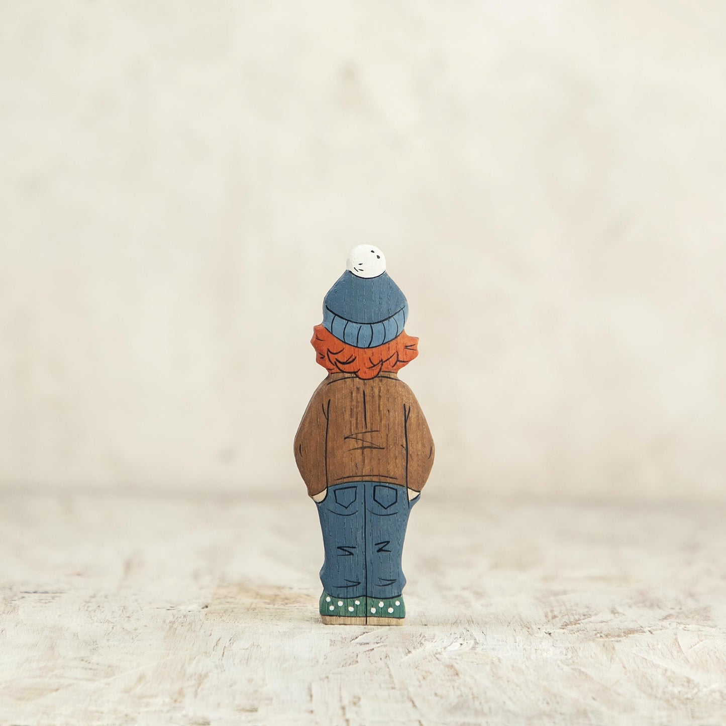 Wooden Girl Figurine in Brown Coat