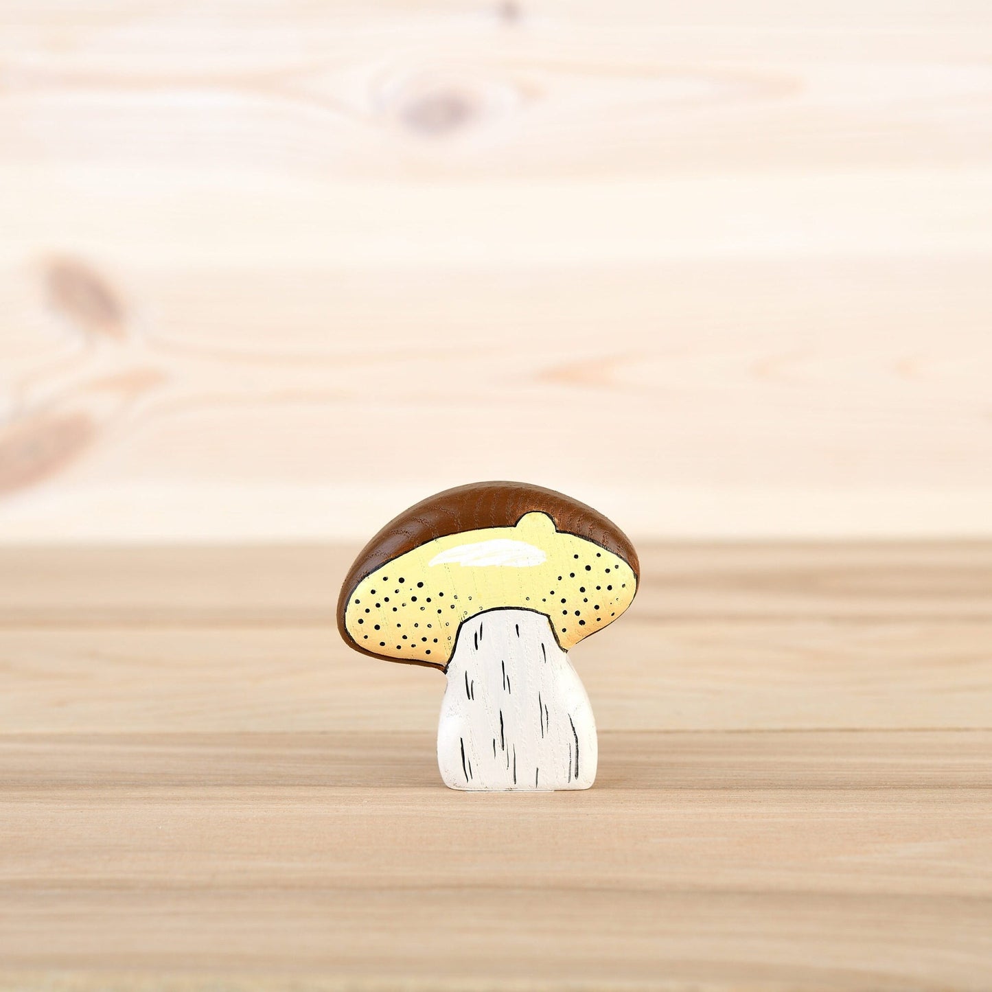 Wooden mushroom with a brown cap