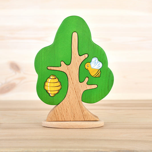 Wooden tree with a bee and hive