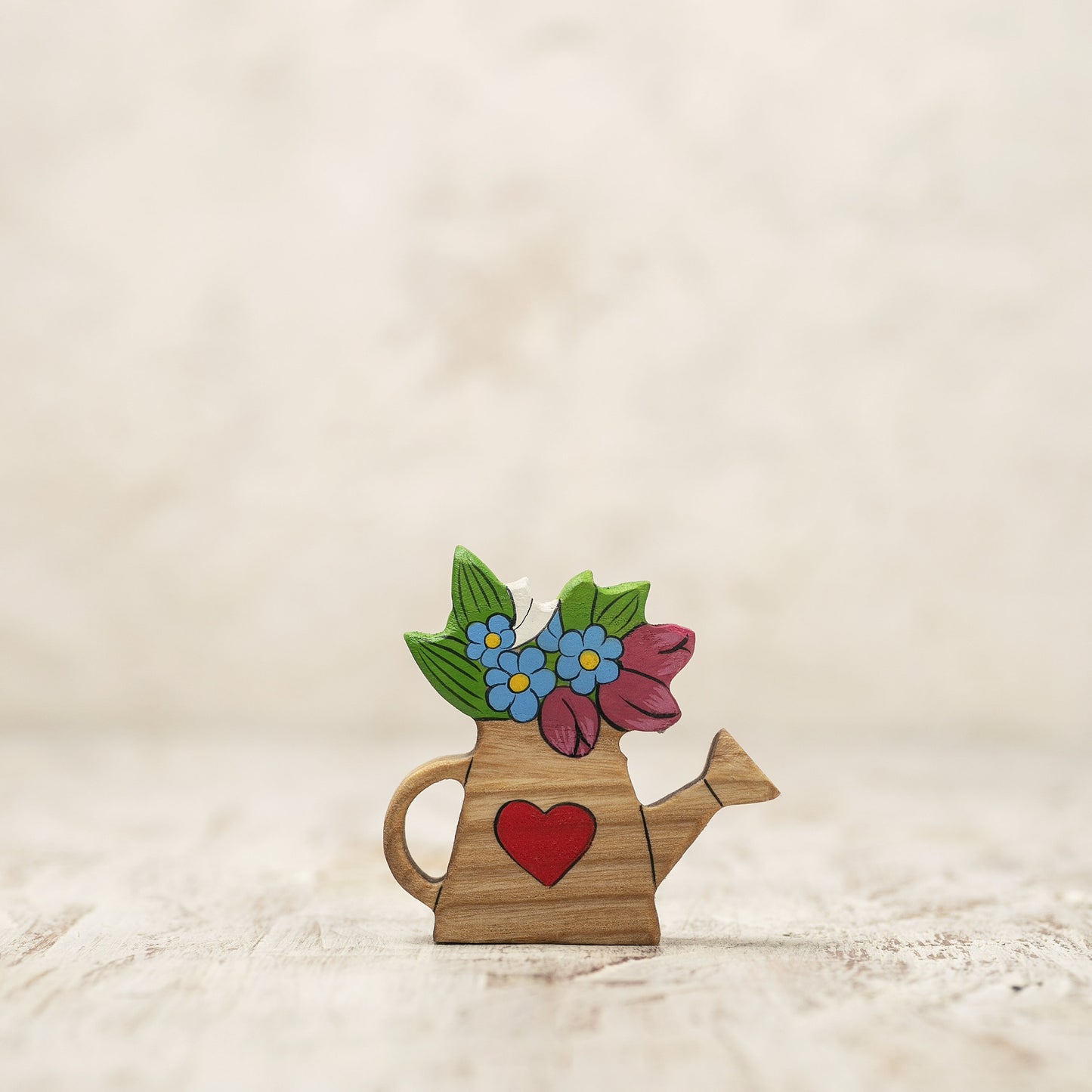 Wooden Watering Can with Colorful Spring Flowers