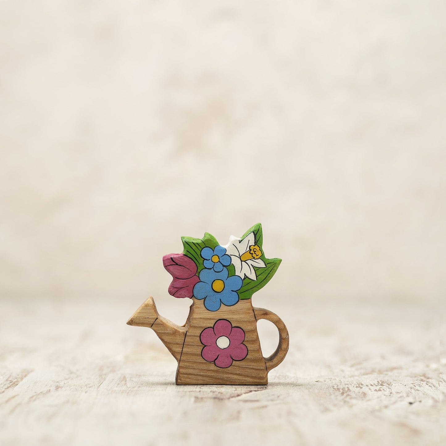 Wooden Watering Can with Colorful Spring Flowers